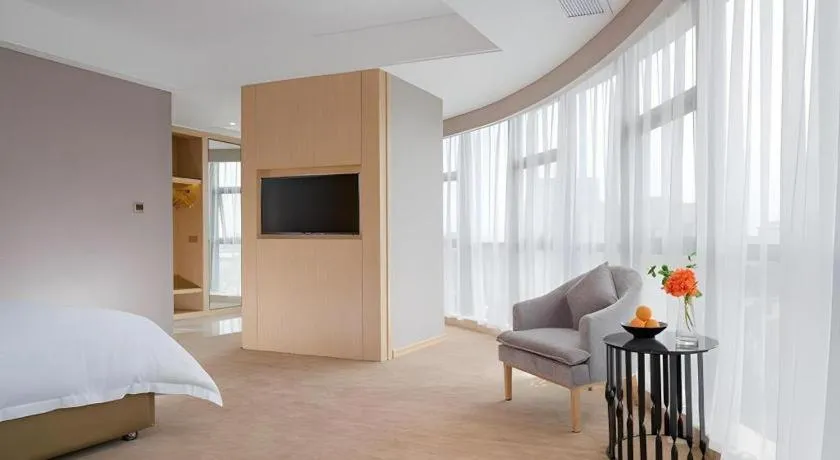 Bed in Vienna Hotel Guangdong Zhongshan Xiaolan High-Speed Railway Station