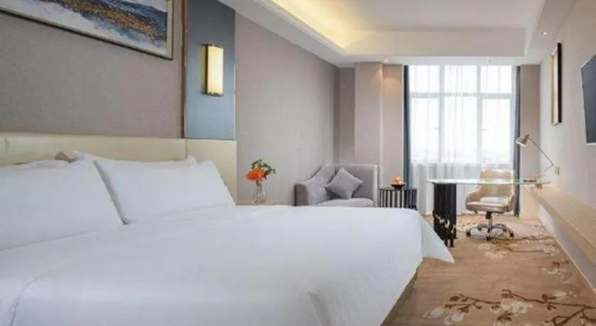 Bed in Vienna Hotel Guangdong Zhongshan Xiaolan High-Speed Railway Station