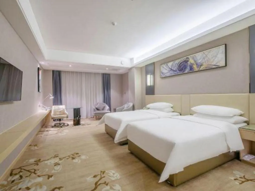 Bed in Vienna Hotel Guangdong Zhongshan Xiaolan High-Speed Railway Station