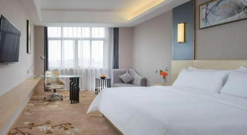 Bed in Vienna Hotel Guangdong Zhongshan Xiaolan High-Speed Railway Station