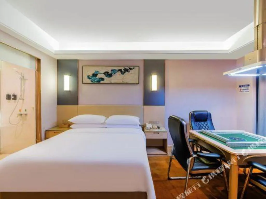 Bed in Vienna Hotel Guangdong Zhongshan Xiaolan High-Speed Railway Station