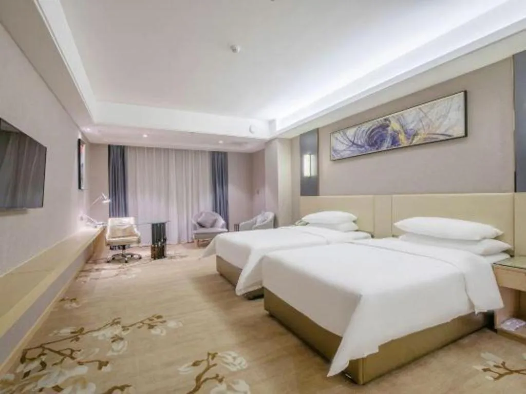 Bed in Vienna Hotel Guangdong Zhongshan Xiaolan High-Speed Railway Station