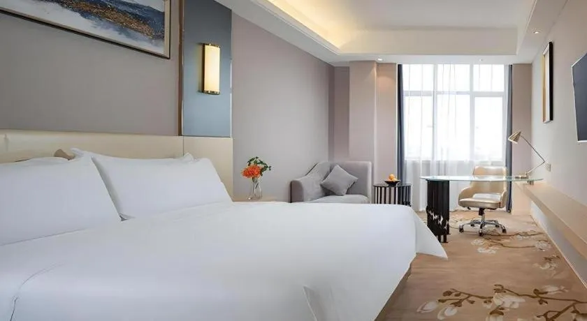 Bed in Vienna Hotel Guangdong Zhongshan Xiaolan High-Speed Railway Station