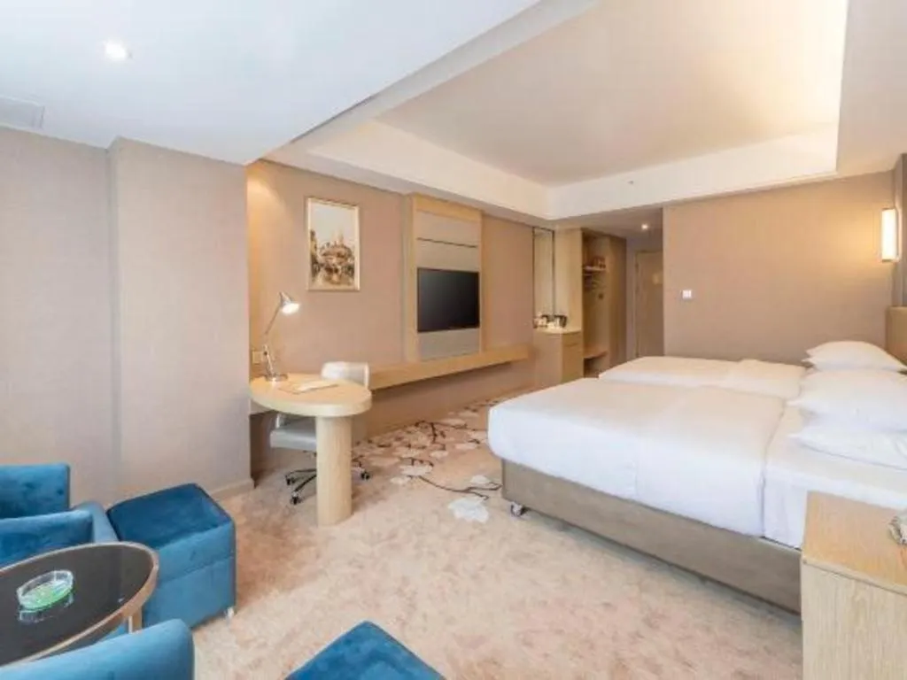 Bed in Vienna Hotel Fuzhou Changle Shouzhan Hangcheng Metro Station