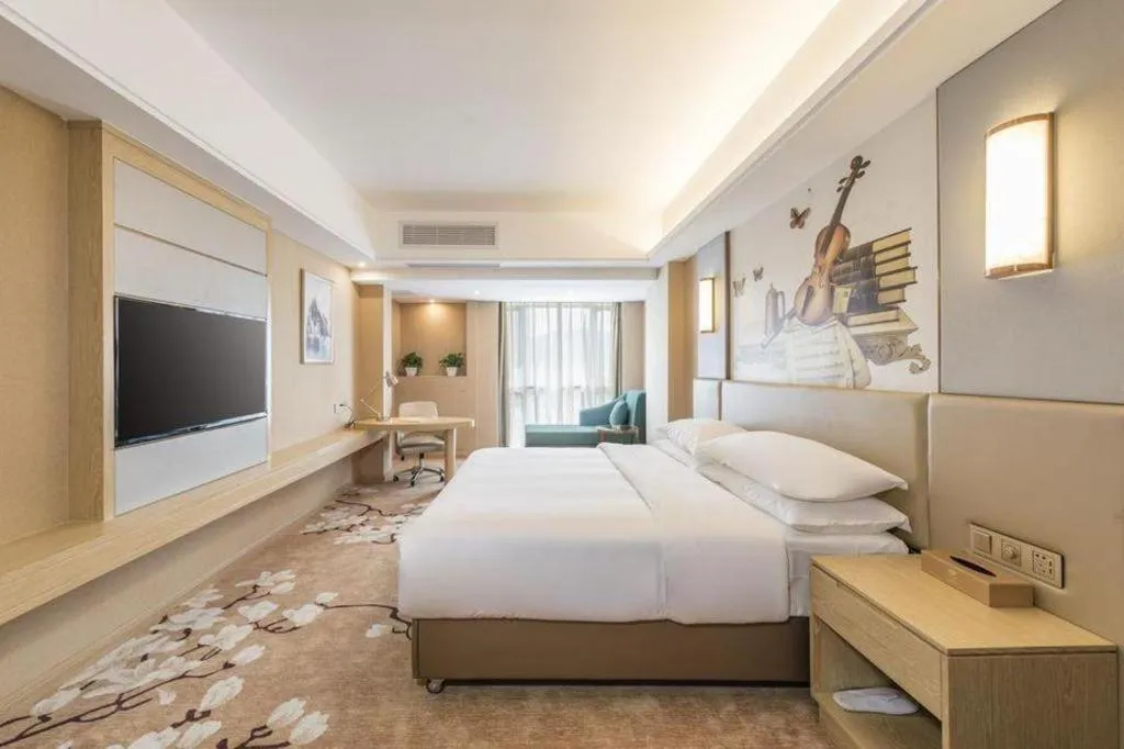 Bed in Vienna Hotel Fuzhou Changle Shouzhan Hangcheng Metro Station