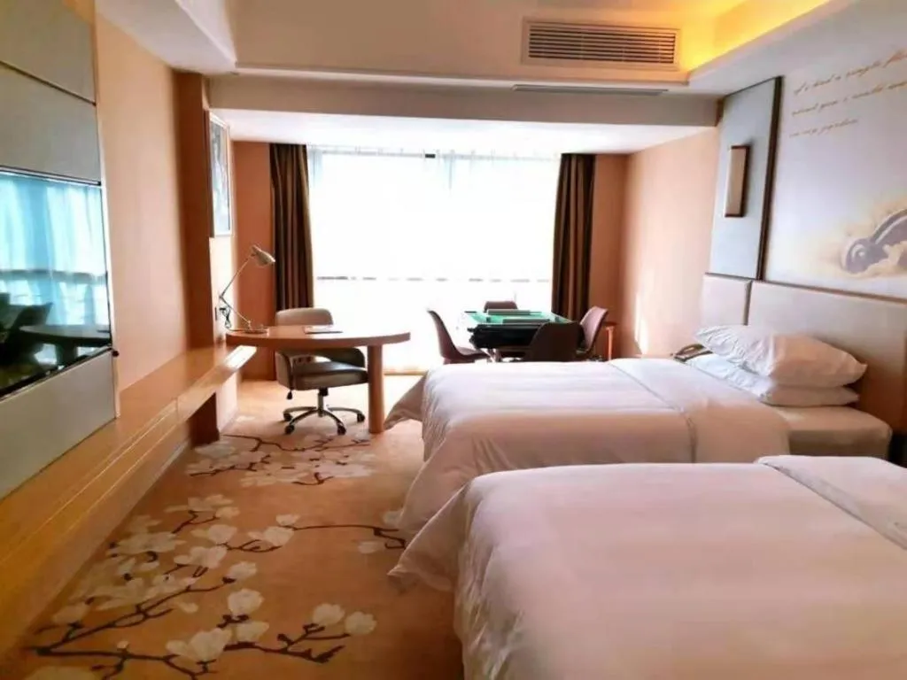 Bed in Vienna Hotel Fuzhou Changle Shouzhan Hangcheng Metro Station