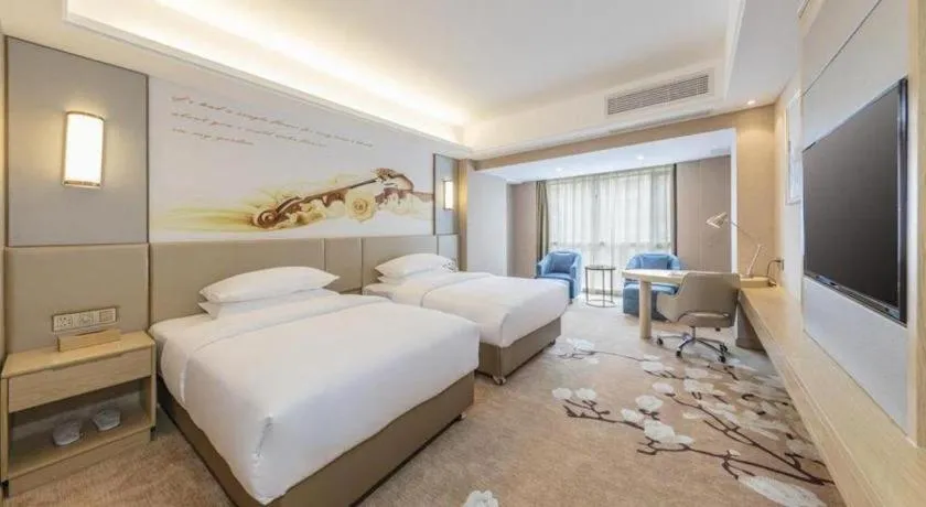 Bed in Vienna Hotel Fuzhou Changle Shouzhan Hangcheng Metro Station