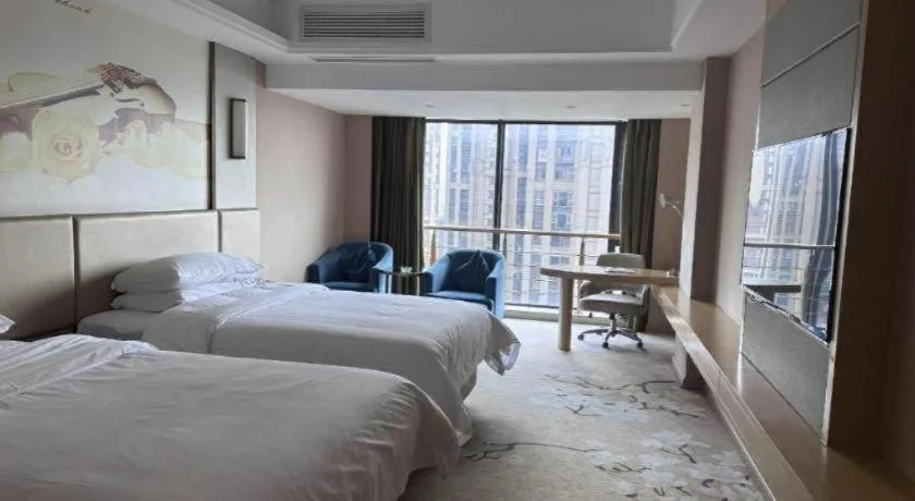 Bed in Vienna Hotel Fuzhou Changle Shouzhan Hangcheng Metro Station