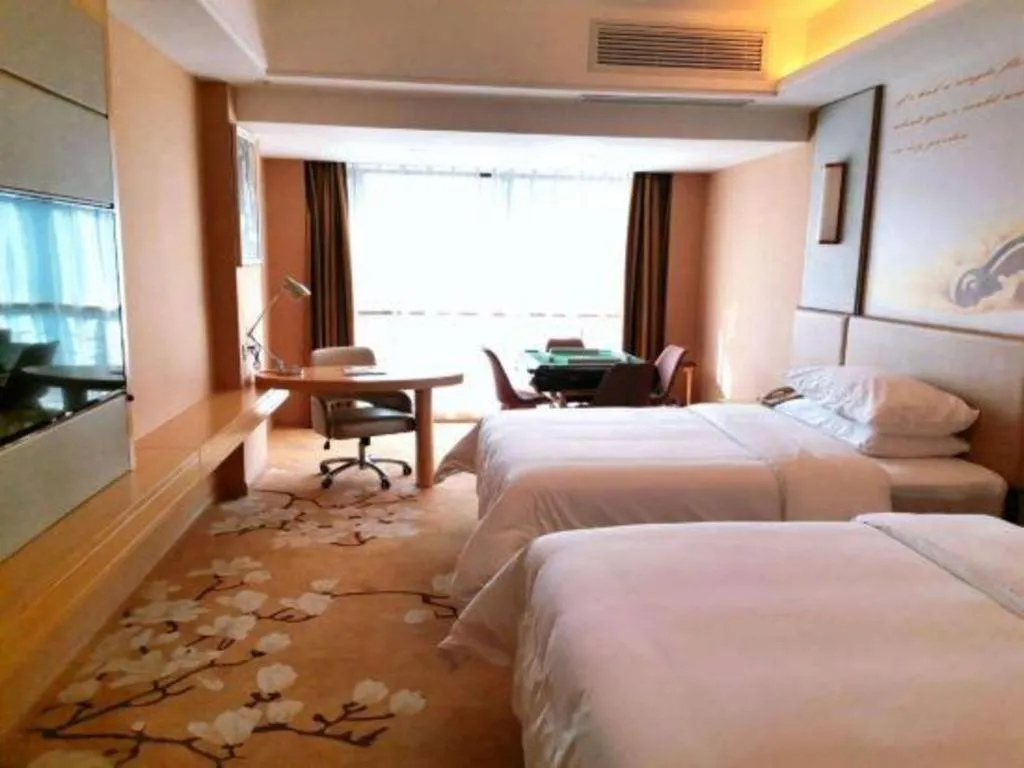 Bed in Vienna Hotel Fuzhou Changle Shouzhan Hangcheng Metro Station