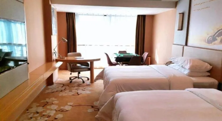 Bed in Vienna Hotel Fuzhou Changle Shouzhan Hangcheng Metro Station
