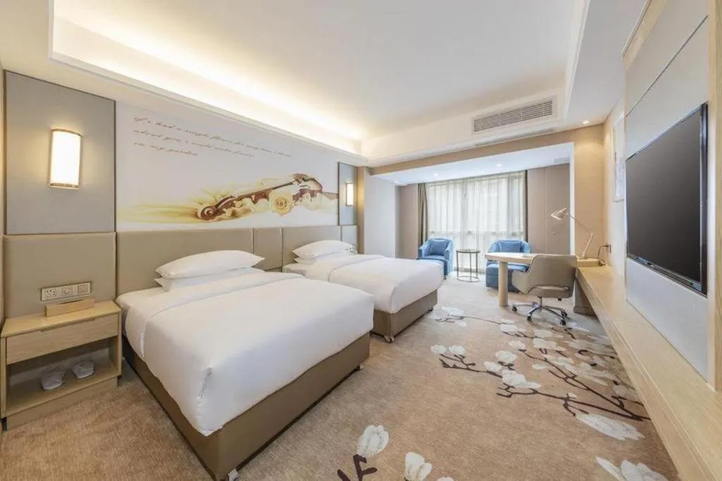 Bed in Vienna Hotel Fuzhou Changle Shouzhan Hangcheng Metro Station