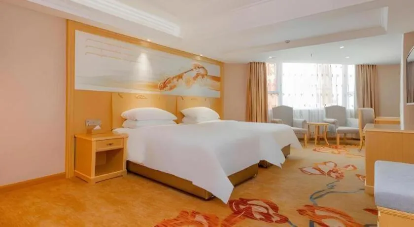 Bed in Vienna Hotel Guangxi Hezhou Guposhan Suifeng