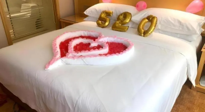 Bed in Vienna Hotel Guangxi Hezhou Guposhan Suifeng