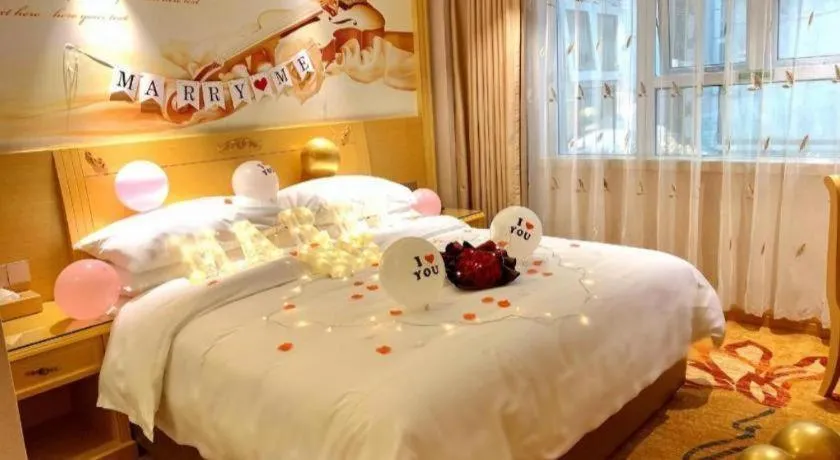 Bed in Vienna Hotel Guangxi Hezhou Guposhan Suifeng