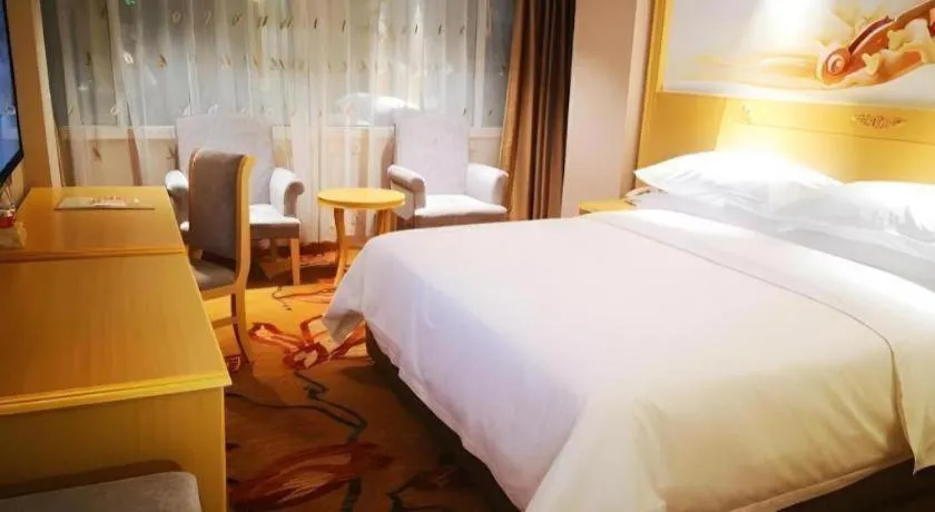 Bed in Vienna Hotel Guangxi Hezhou Guposhan Suifeng