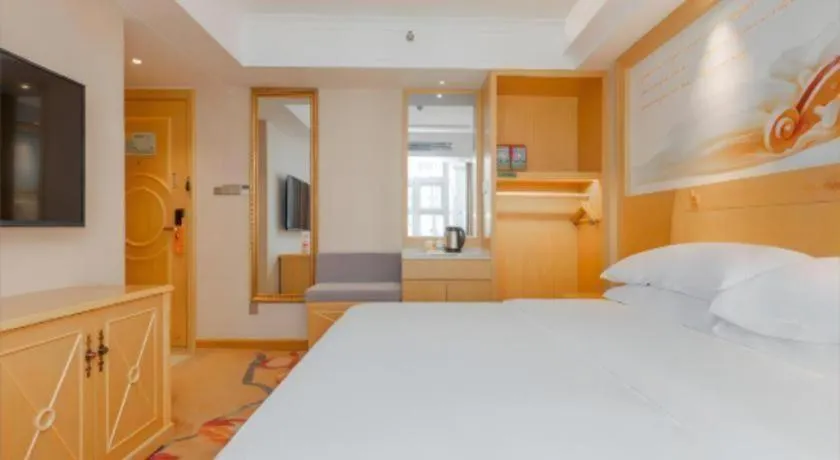 Bed in Vienna Hotel Guangxi Hezhou Guposhan Suifeng