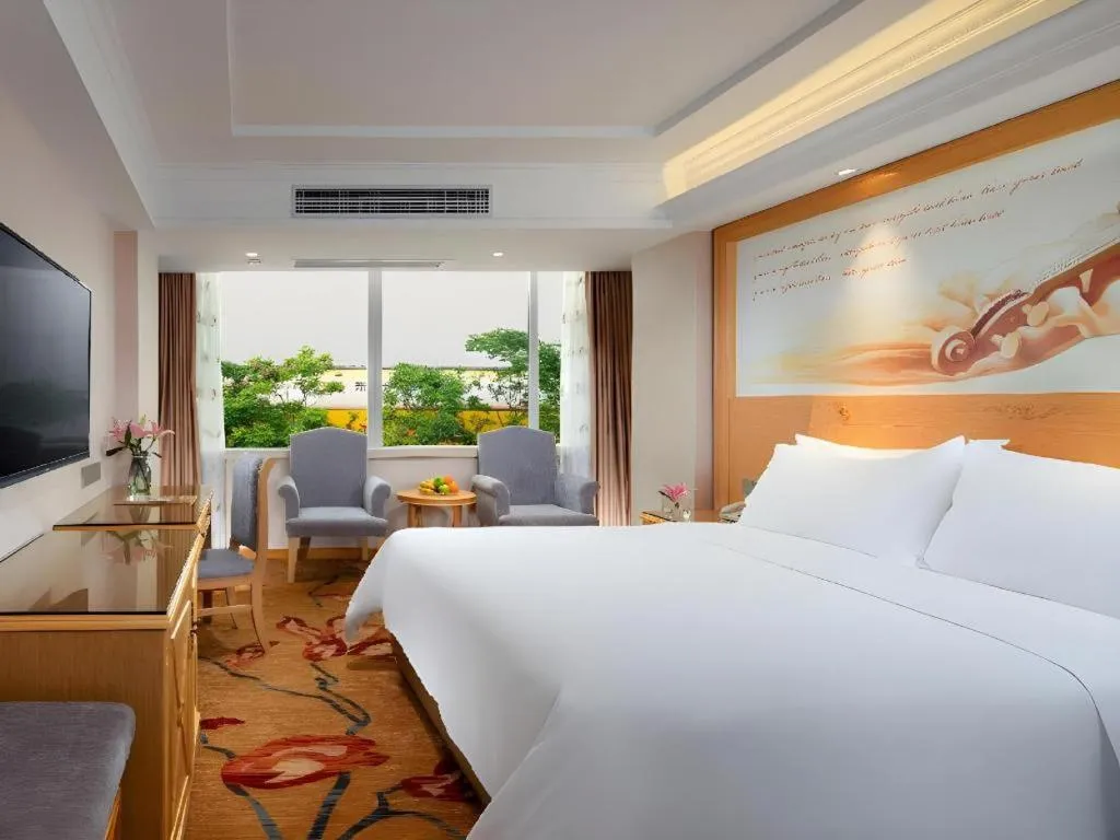 Bed in Vienna Hotel Guangxi Hezhou Guposhan Suifeng