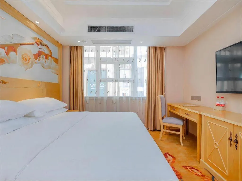 Bed in Vienna Hotel Guangxi Hezhou Guposhan Suifeng