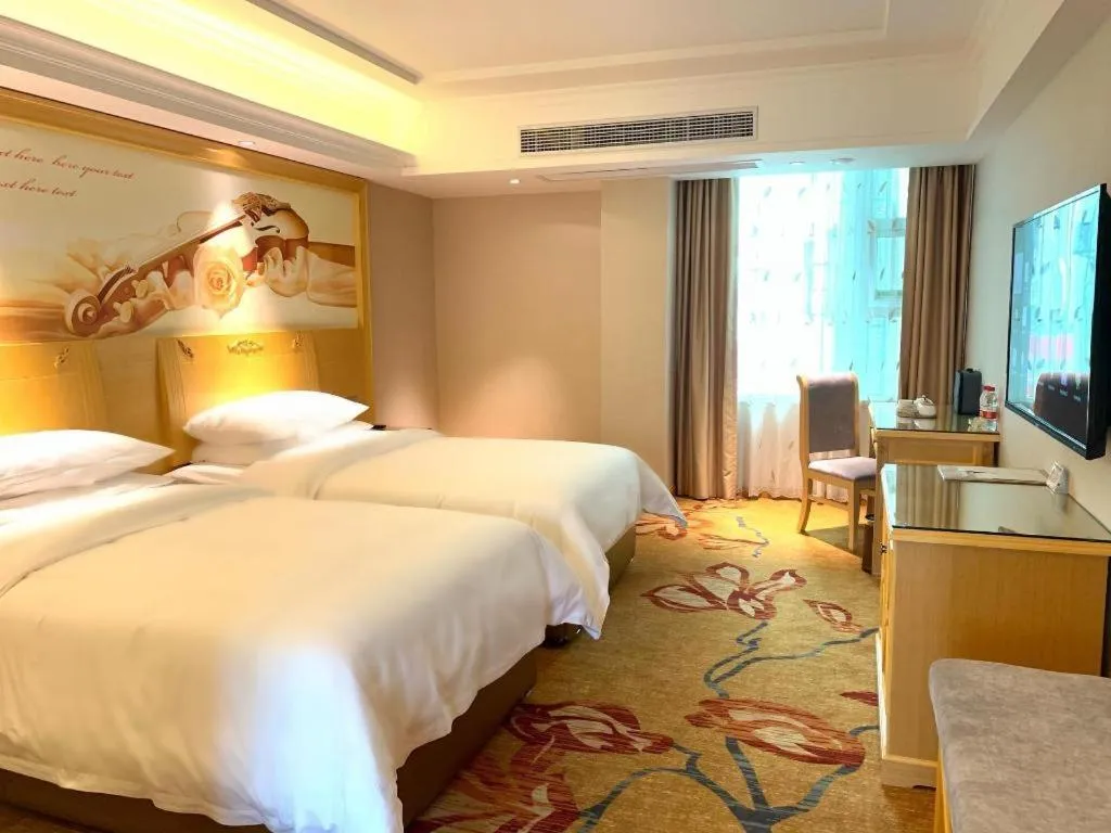 Bed in Vienna Hotel Guangxi Hezhou Guposhan Suifeng