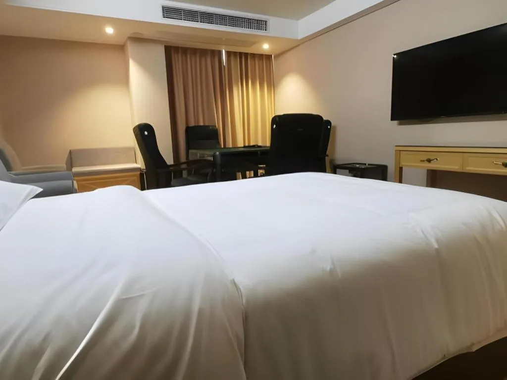 Bed in Vienna Hotel Guangxi Hezhou Guposhan Suifeng