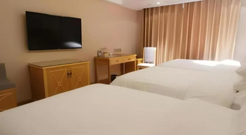 Bed in Vienna Hotel Guangxi Hezhou Guposhan Suifeng