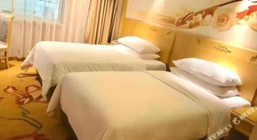 Bed in Vienna Hotel Guangxi Hezhou Guposhan Suifeng