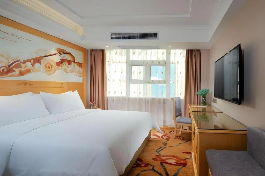 Bed in Vienna Hotel Guangxi Hezhou Guposhan Suifeng