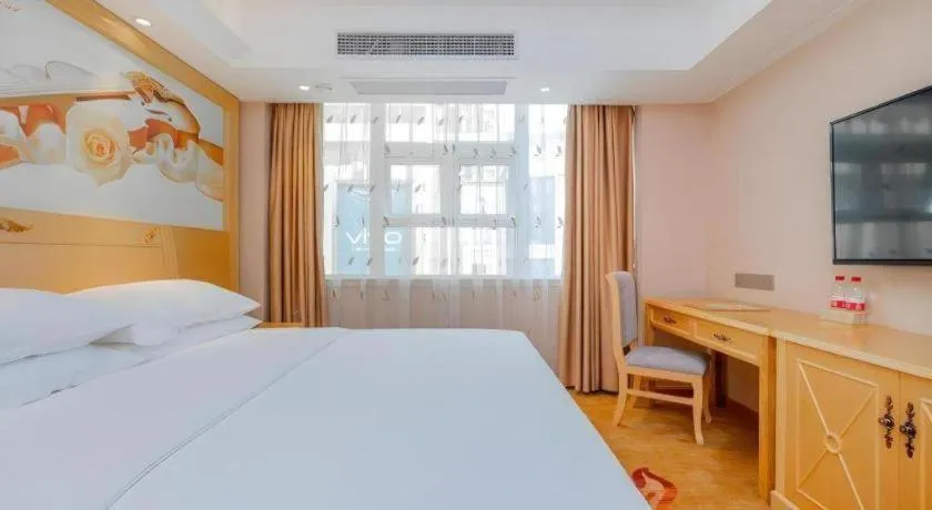 Bed in Vienna Hotel Guangxi Hezhou Guposhan Suifeng