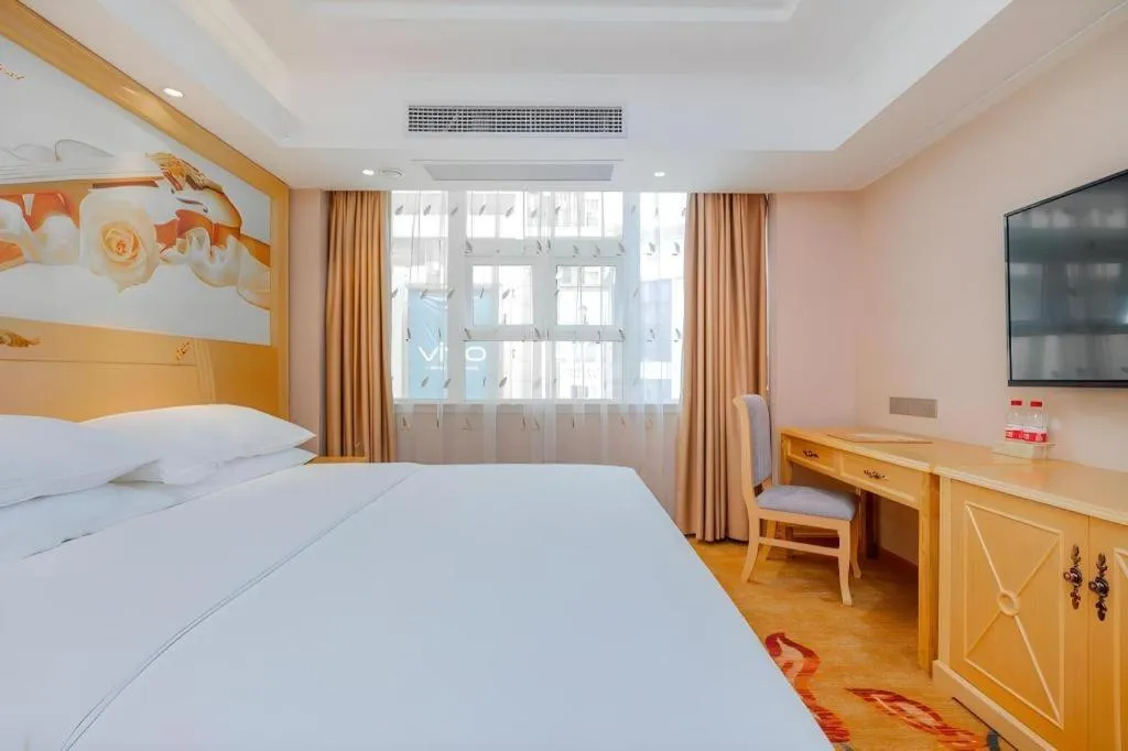 Bed in Vienna Hotel Guangxi Hezhou Guposhan Suifeng