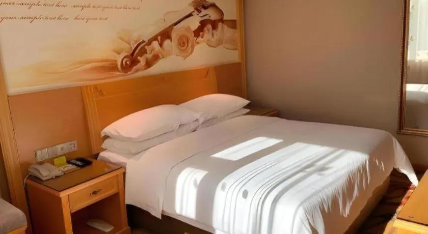 Bed in Vienna Hotel Guangxi Hezhou Guposhan Suifeng