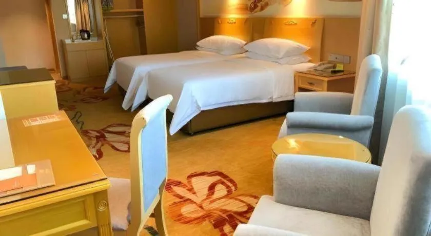 Bed in Vienna Hotel Guangxi Hezhou Guposhan Suifeng