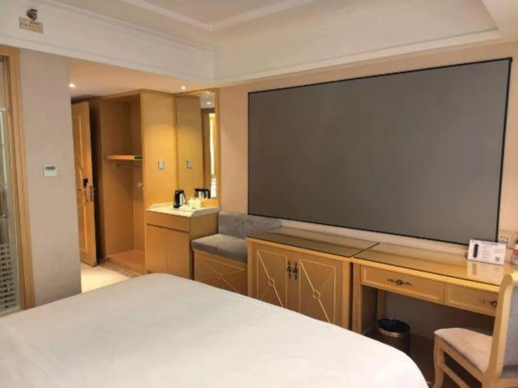 Bed in Vienna Hotel Guangxi Hezhou Guposhan Suifeng