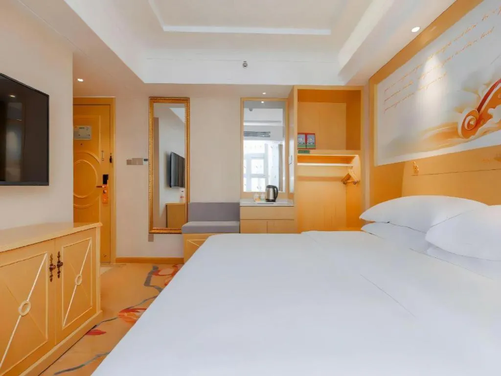 Bed in Vienna Hotel Guangxi Hezhou Guposhan Suifeng