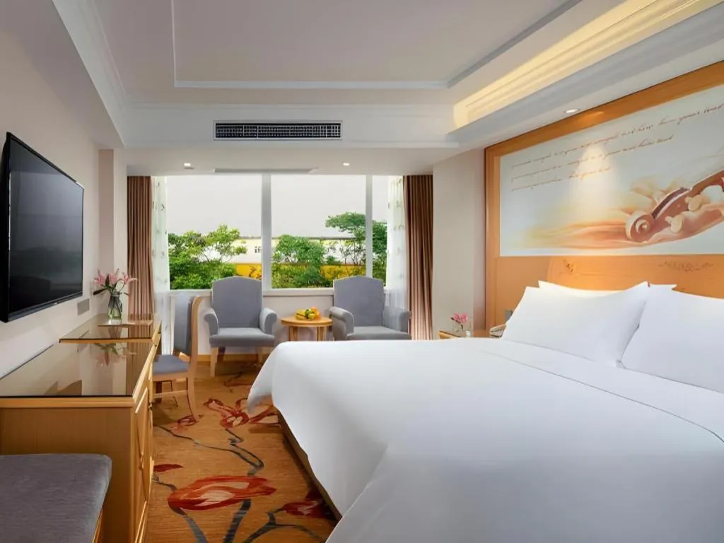 Bed in Vienna Hotel Guangxi Hezhou Guposhan Suifeng