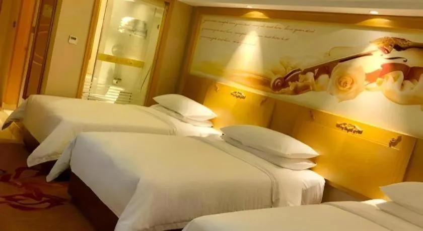 Bed in Vienna Hotel Guangxi Hezhou Guposhan Suifeng