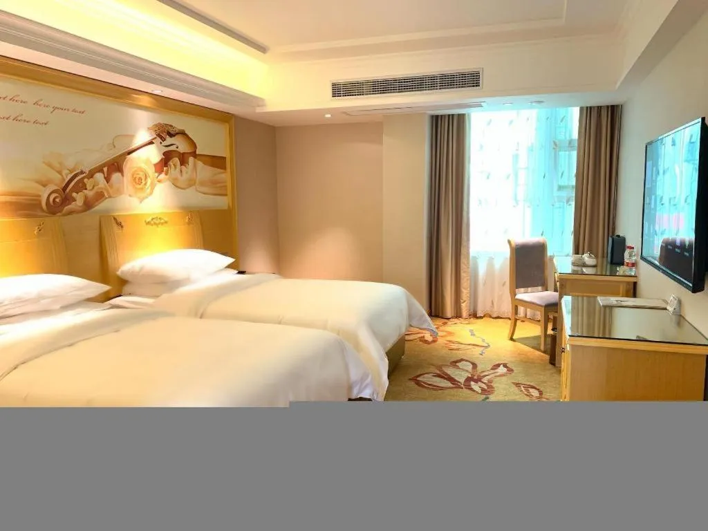 Bed in Vienna Hotel Guangxi Hezhou Guposhan Suifeng