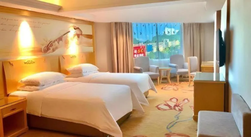 Bed in Vienna Hotel Guangxi Hezhou Guposhan Suifeng