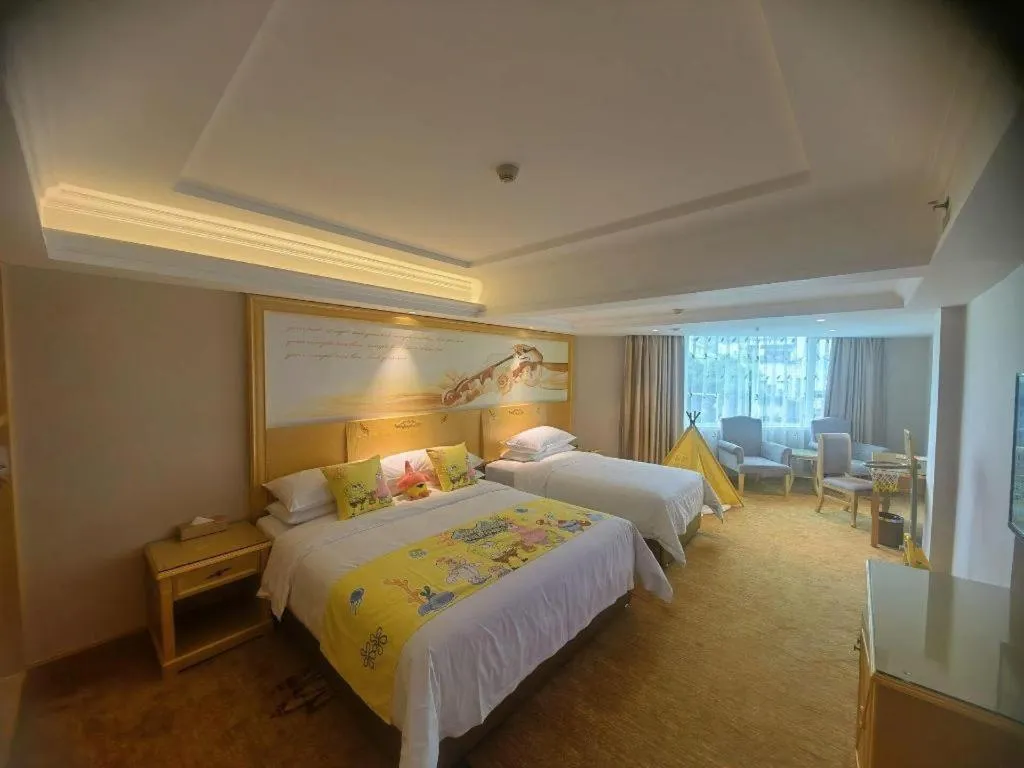 Bed in Vienna Hotel Guangxi Hezhou Guposhan Suifeng