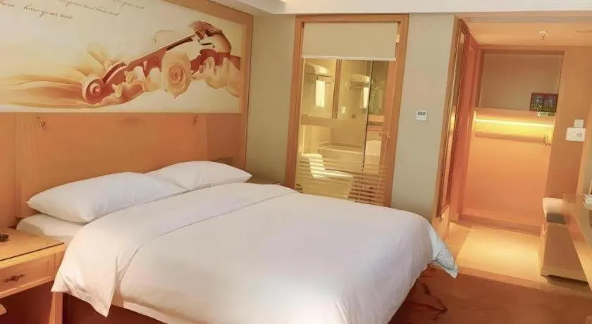 Bed in Vienna Hotel Guangxi Hezhou Guposhan Suifeng