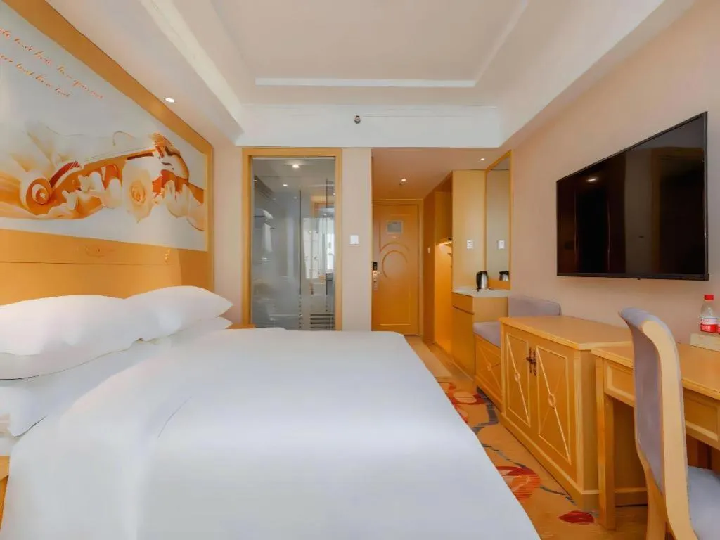 Bed in Vienna Hotel Guangxi Hezhou Guposhan Suifeng