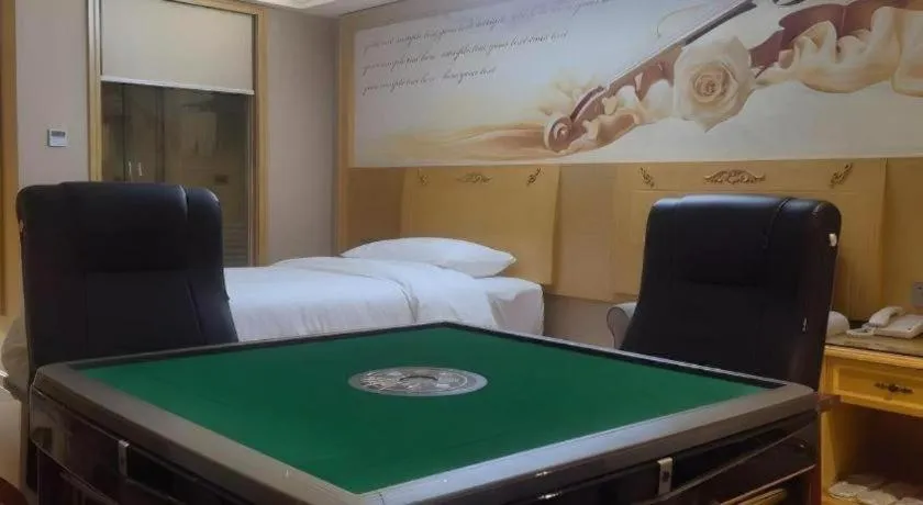 Bed in Vienna Hotel Guangxi Hezhou Guposhan Suifeng