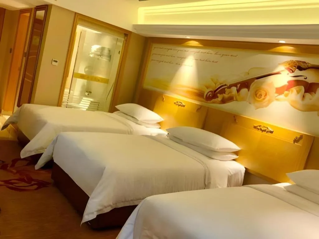 Bed in Vienna Hotel Guangxi Hezhou Guposhan Suifeng