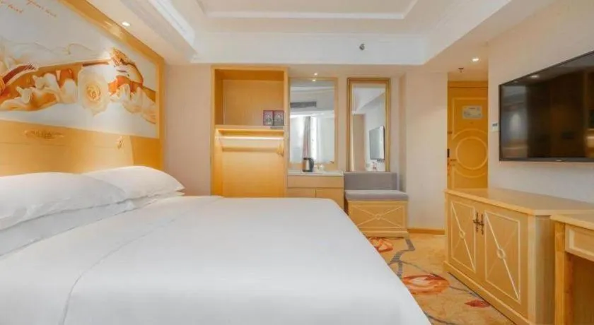 Bed in Vienna Hotel Guangxi Hezhou Guposhan Suifeng