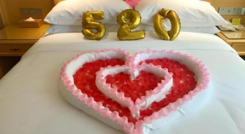 Bed in Vienna Hotel Guangxi Hezhou Guposhan Suifeng