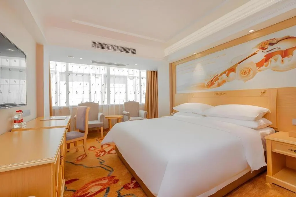 Bed in Vienna Hotel Guangxi Hezhou Guposhan Suifeng