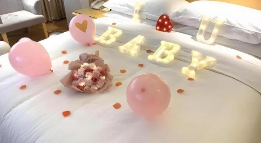 Bed in Vienna Hotel Guangxi Hezhou Guposhan Suifeng