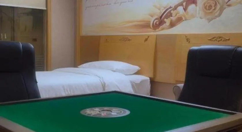 Bed in Vienna Hotel Guangxi Hezhou Guposhan Suifeng