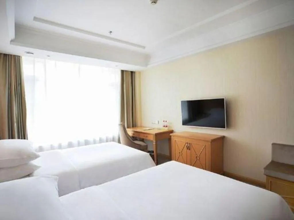 Bed in Vienna Hotel Shenyang Central Street