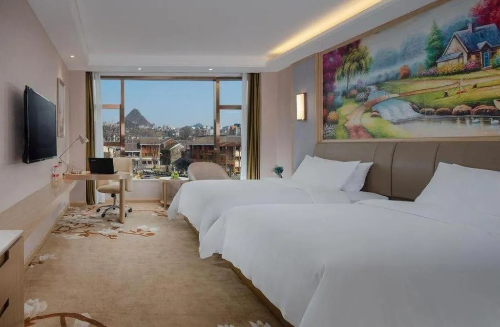 Bed in Vienna Hotel Guizhou Liupanshui Shuicheng Ancient Town