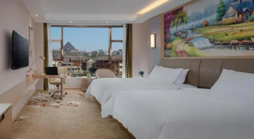 Bed in Vienna Hotel Guizhou Liupanshui Shuicheng Ancient Town